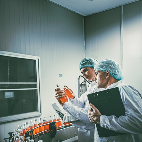 Image showing two researchers from F&B industry doing a quality audit